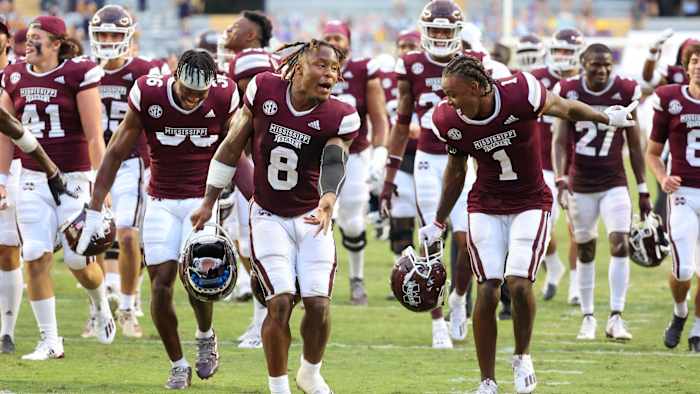 Mississippi State Bulldogs running back Kylin Hill (8) celebrates with cornerback Martin Emerson (1) following a 44-34 win against the LSU Tigers at Tiger Stadium.